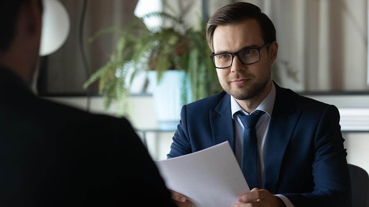 An image of a preneed agent communicating with a client.