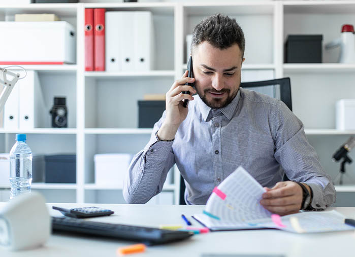 An image of a financial planner checking leads from Lead Concepts.
